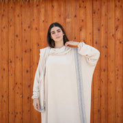 Model wearing Tallah's beige CY Isdal with vertical trim panel, gallery photo 1