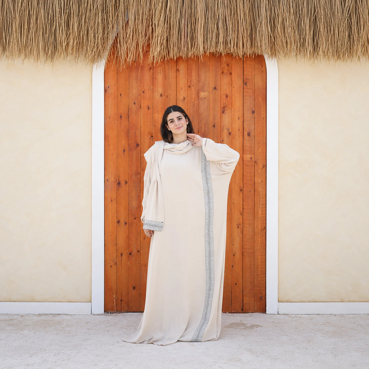 Model wearing Tallah's beige CY Isdal with vertical trim panel, gallery photo 2