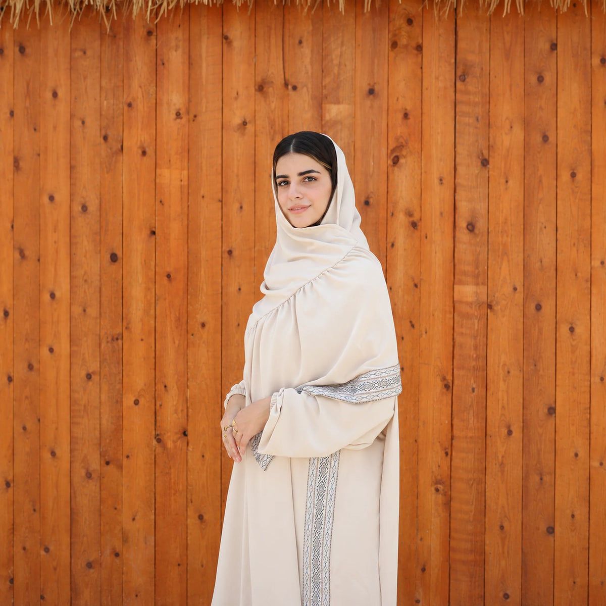 Model wearing Tallah's beige CY Isdal with vertical trim panel, gallery photo 4