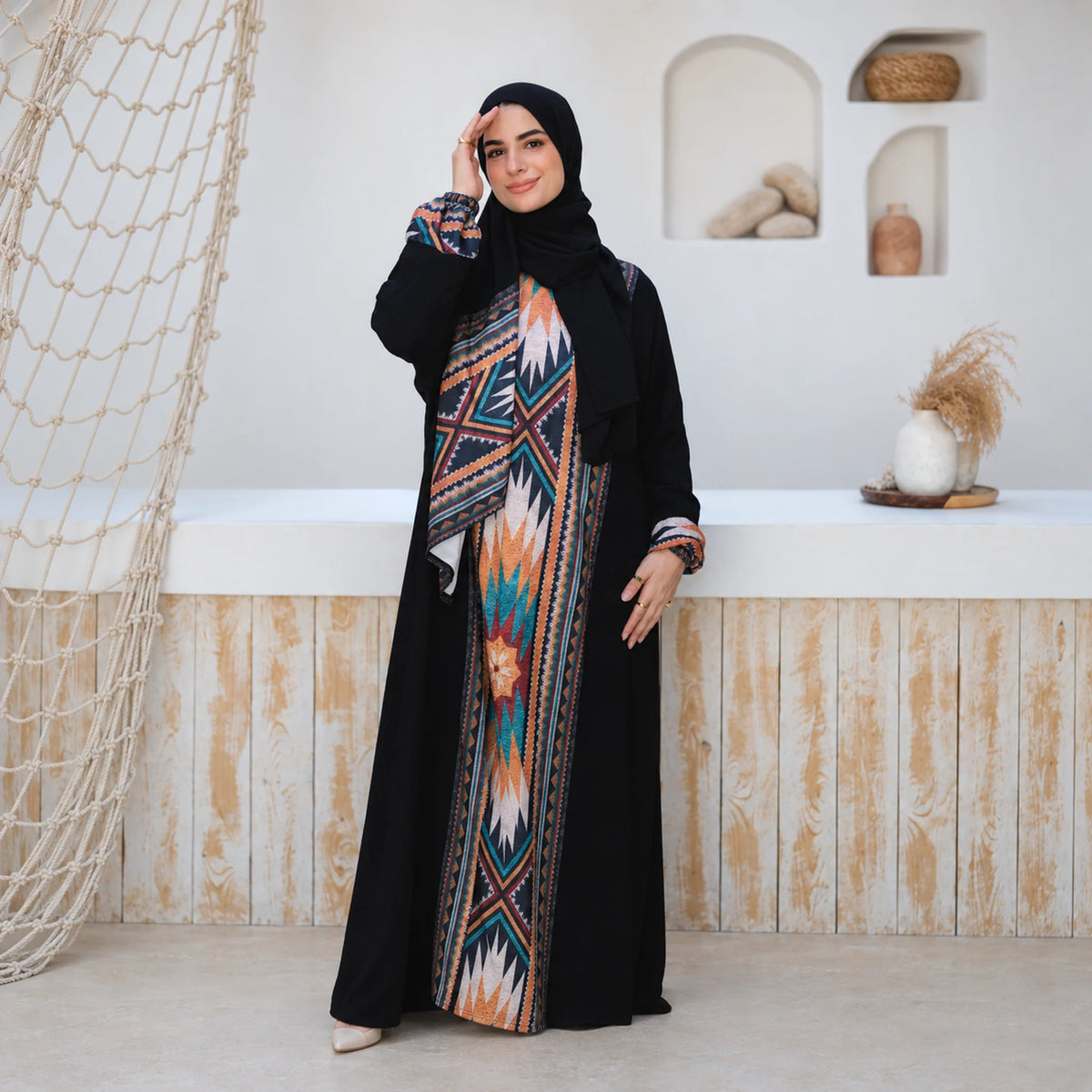 Model wearing Tallah's black CY Isdal with aztec-print panel, gallery photo 1