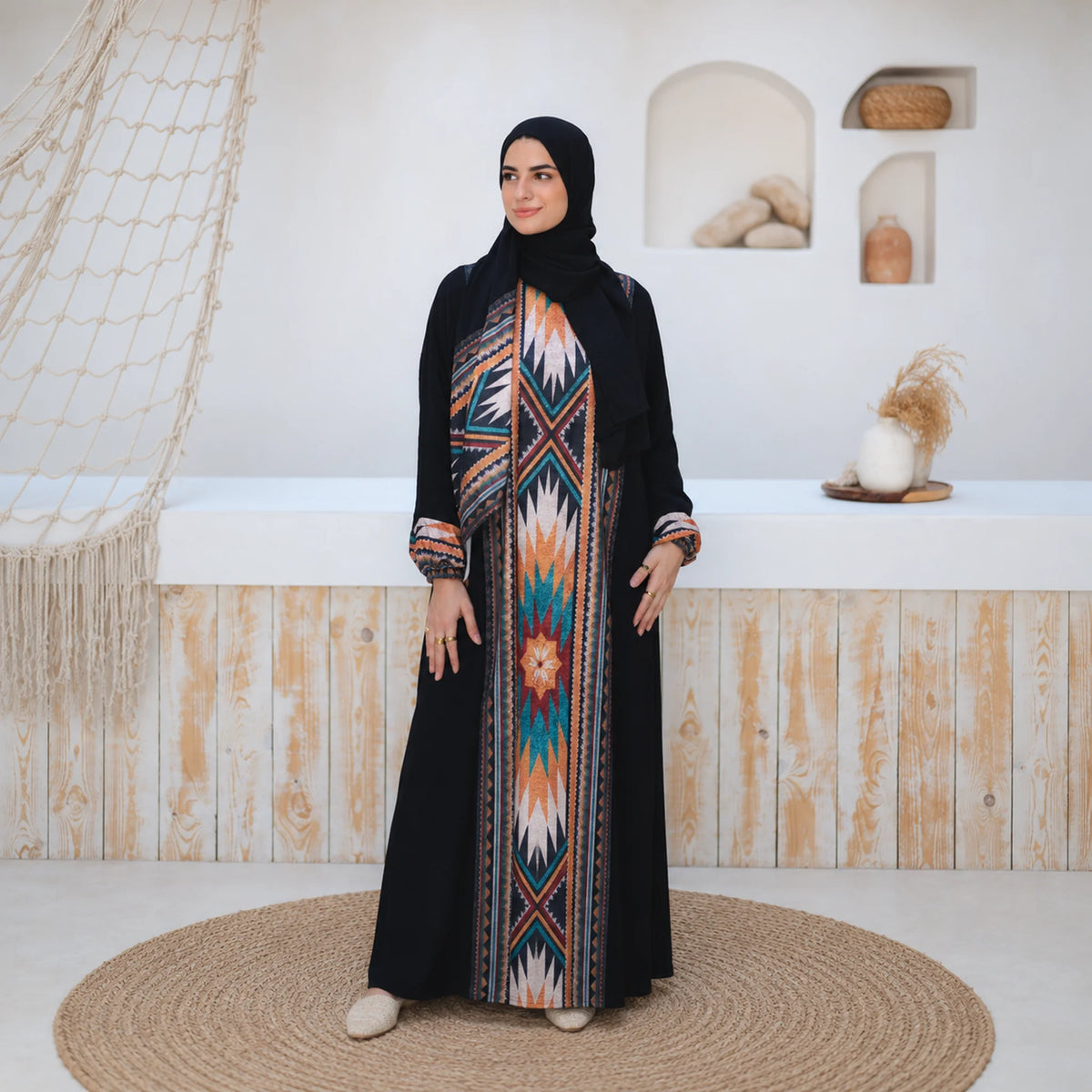 Model wearing Tallah's black CY Isdal with aztec-print panel, gallery photo 2