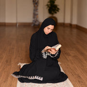 Model wearing Tallah's black CY Isdal with lace trim, gallery photo 1