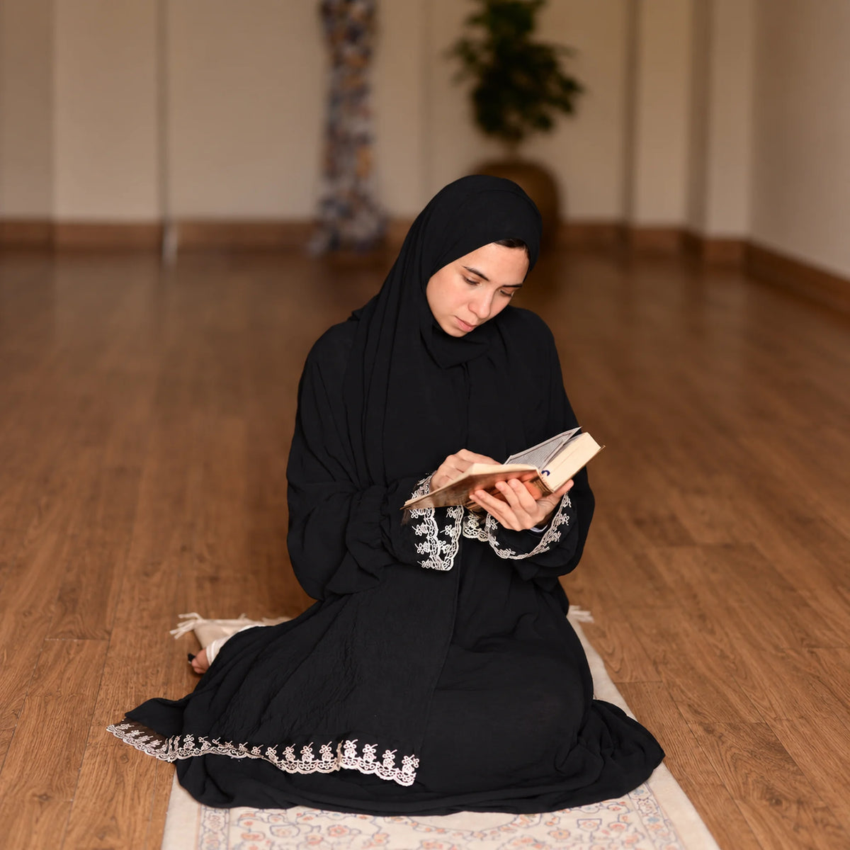 Model wearing Tallah's black CY Isdal with lace trim, gallery photo 1