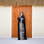 Model wearing Tallah's black CY Isdal with mixed-print split panel, gallery photo 1