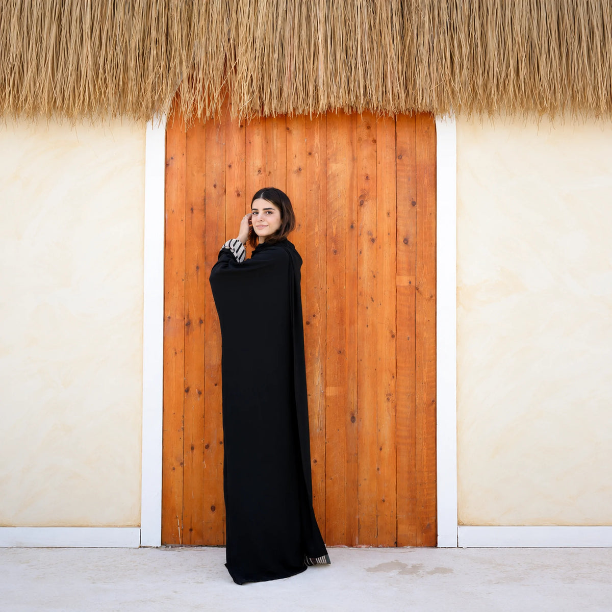 Model wearing Tallah's black CY Isdal with mixed-print split panel, gallery photo 2