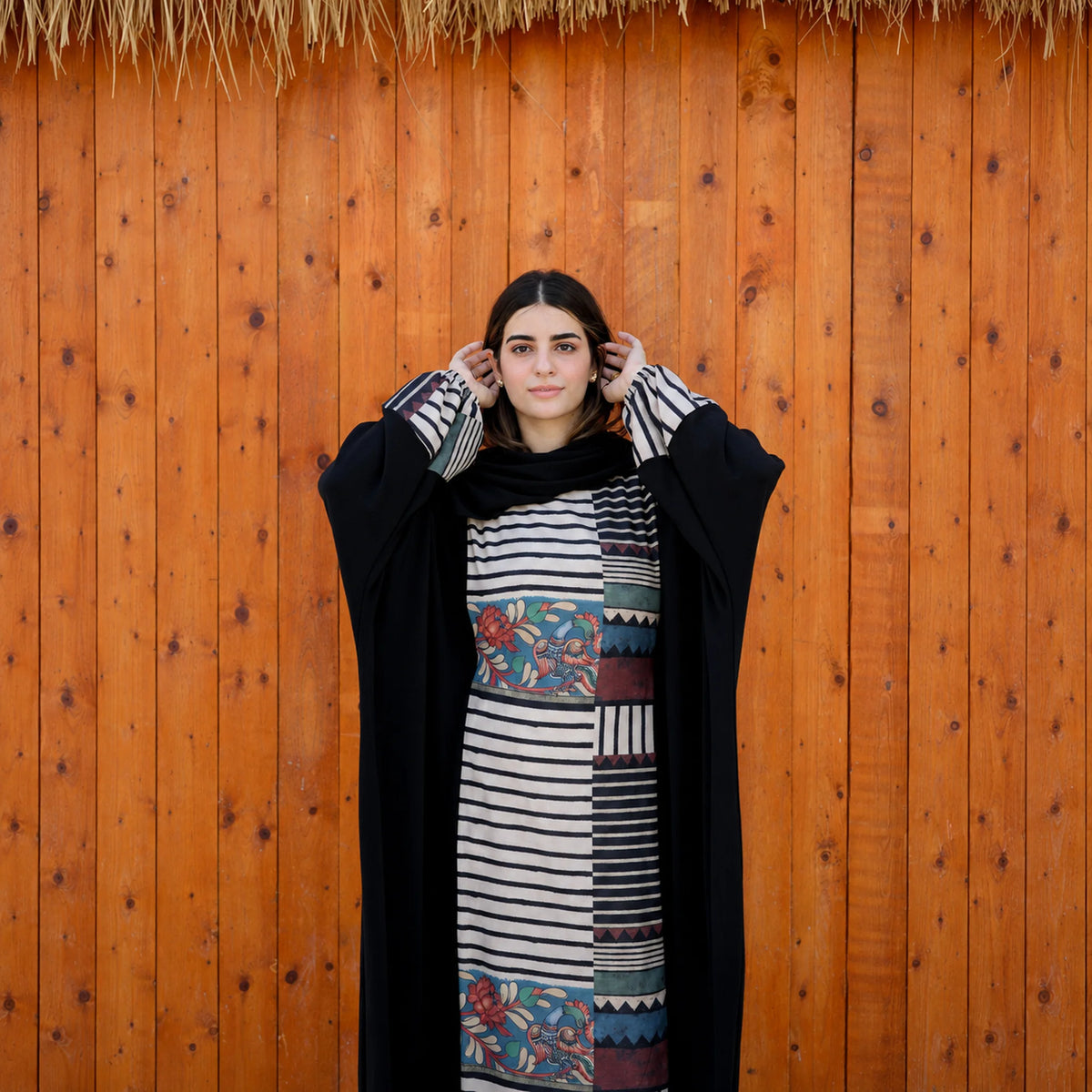 Model wearing Tallah's black CY Isdal with mixed-print split panel, gallery photo 3