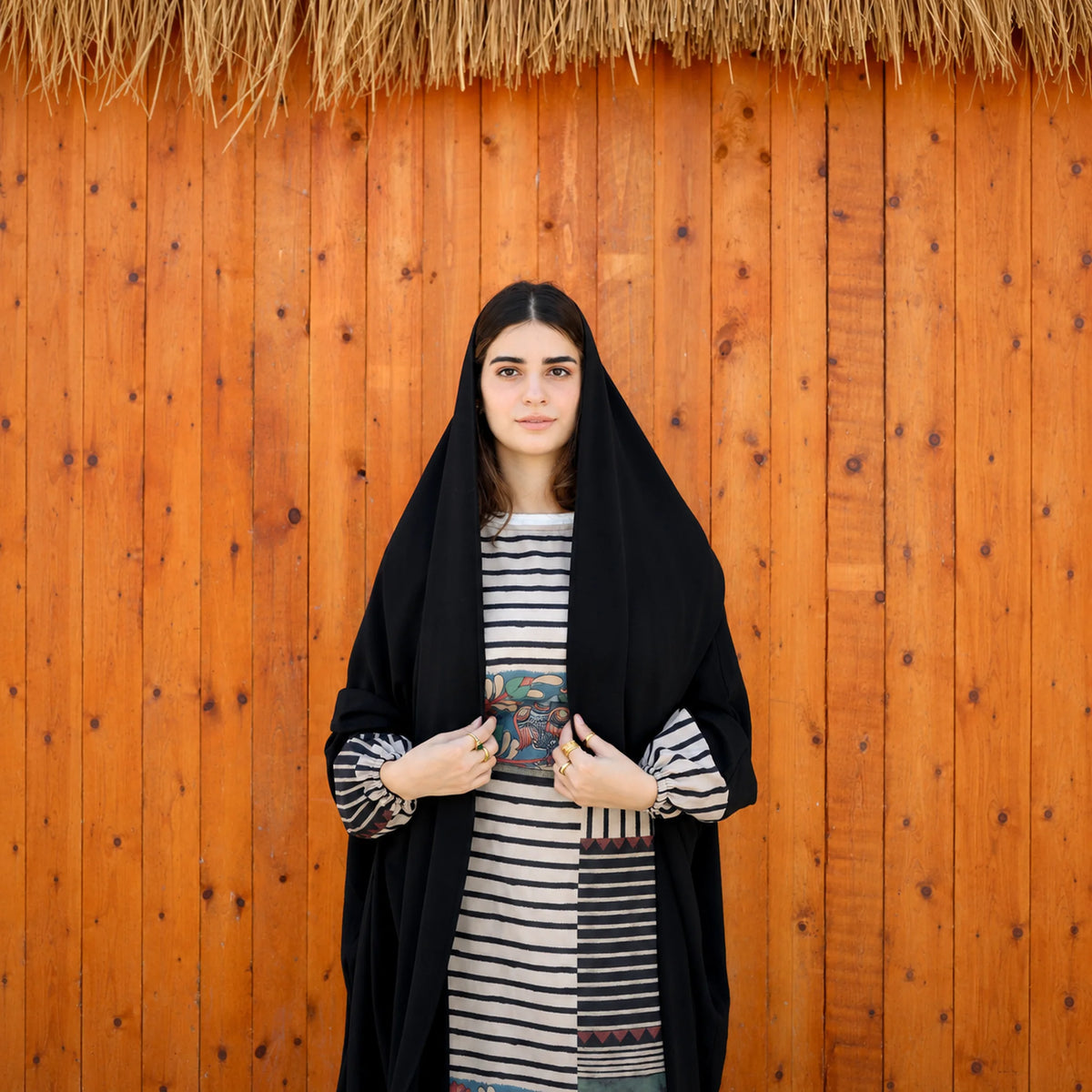 Model wearing Tallah's black CY Isdal with mixed-print split panel, gallery photo 4
