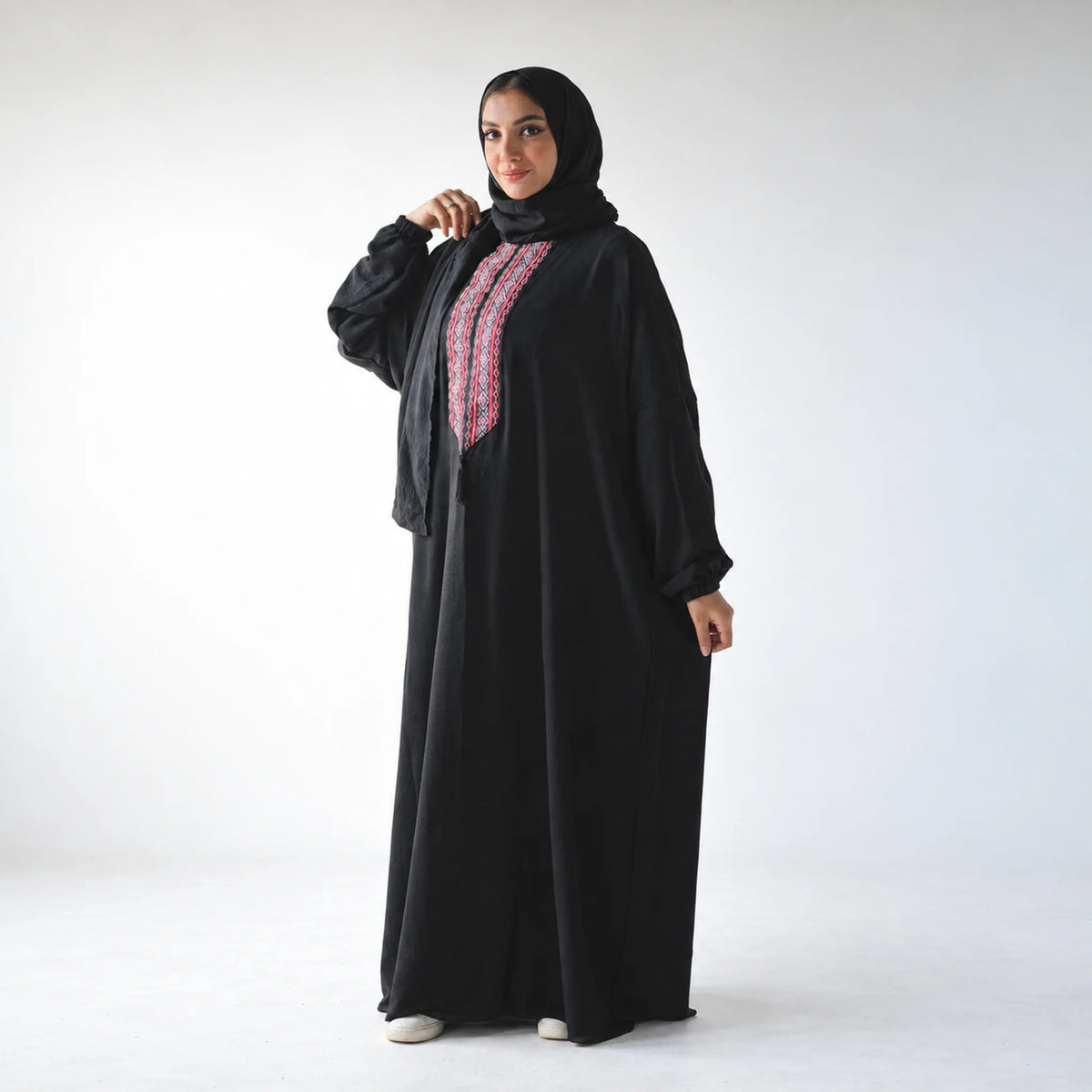 Model wearing Tallah's black CY Isdal with multicolour tatreez placket, gallery photo 1