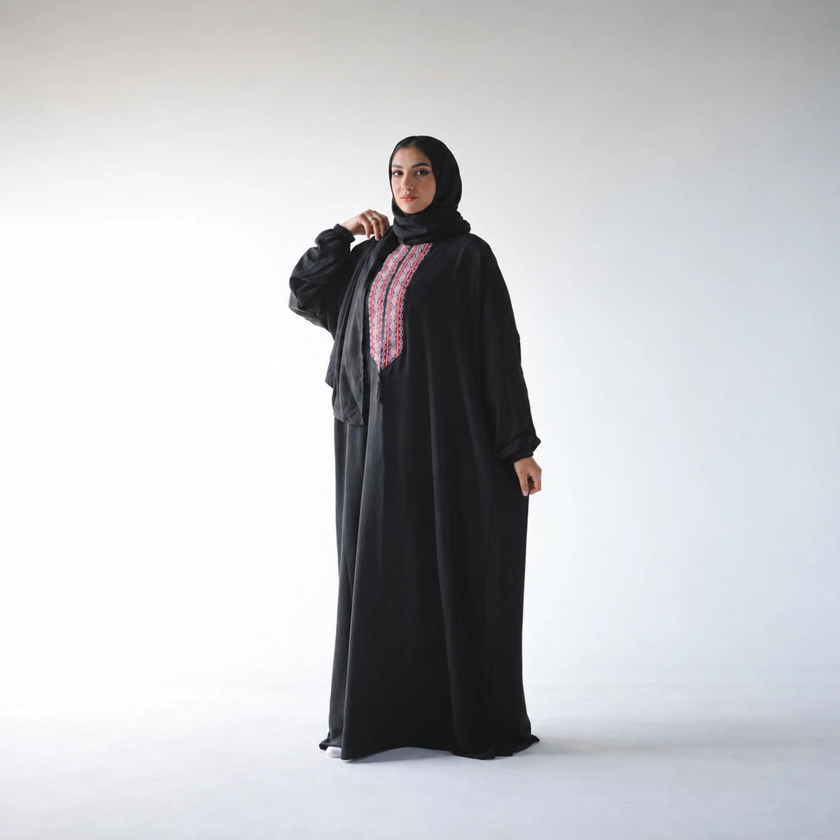 Model wearing Tallah's black CY Isdal with multicolour tatreez placket, gallery photo 2