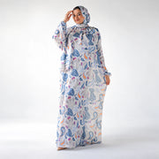 Full-length front view of a blue and white CY Isdal with an abstract print and peach and purple accents.
