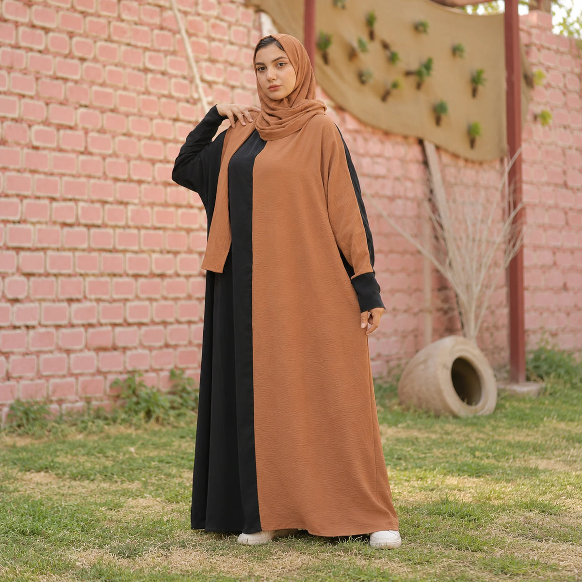 Model wearing Tallah's camel CY Isdal with black colour-block panel, gallery photo 2
