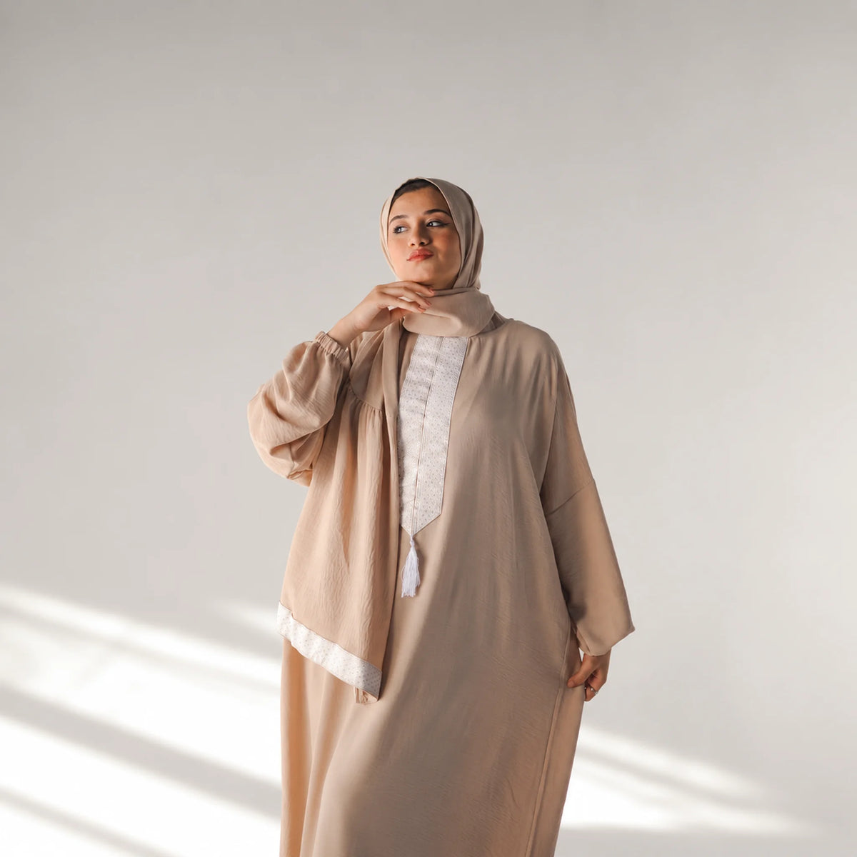 Model wearing Tallah's coffee-brown CY Isdal with white panel trim, gallery photo 3