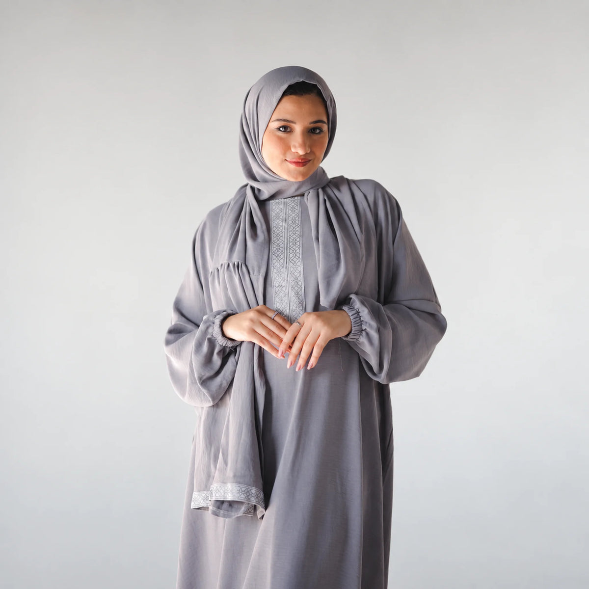 Model wearing Tallah's grey CY Isdal with vertical embroidered panel, gallery photo 2