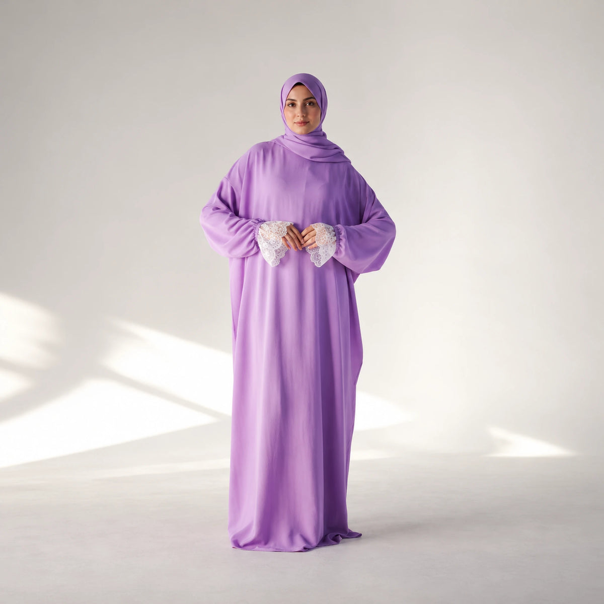 Alternate view 3 of a cy isdal in lilac, white lace cuffs.