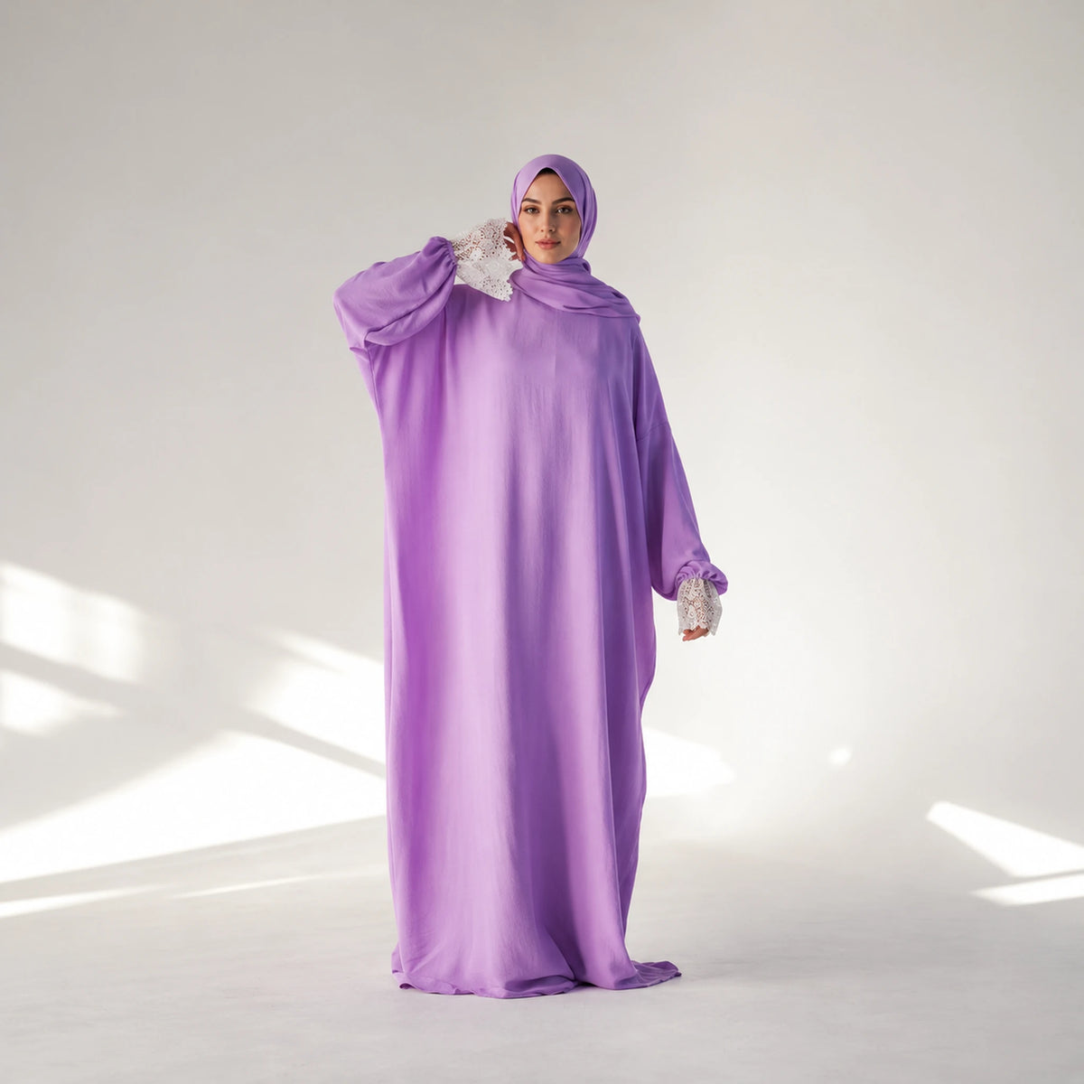 Alternate view of a CY Isdal in Lilac, white lace cuffs.