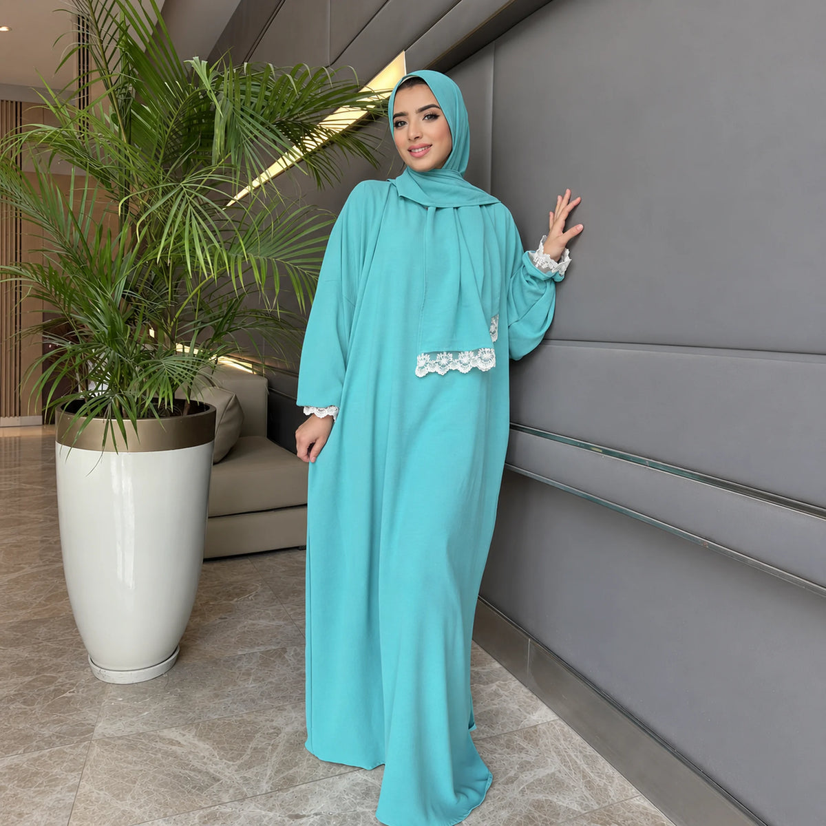 Model wearing Tallah's mint CY Isdal with lace pocket and cuff trim, gallery photo 1