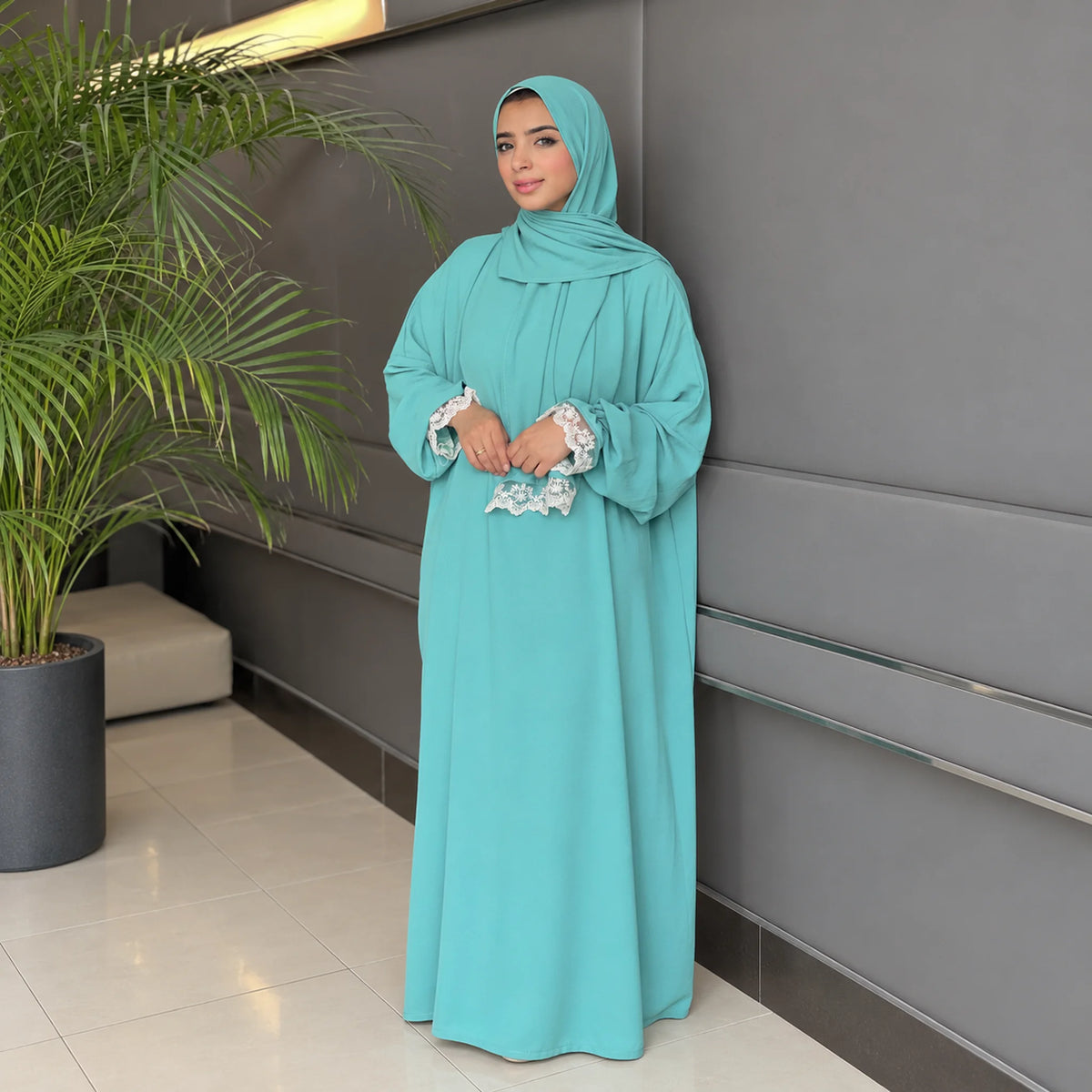 Model wearing Tallah's mint CY Isdal with lace pocket and cuff trim, gallery photo 2