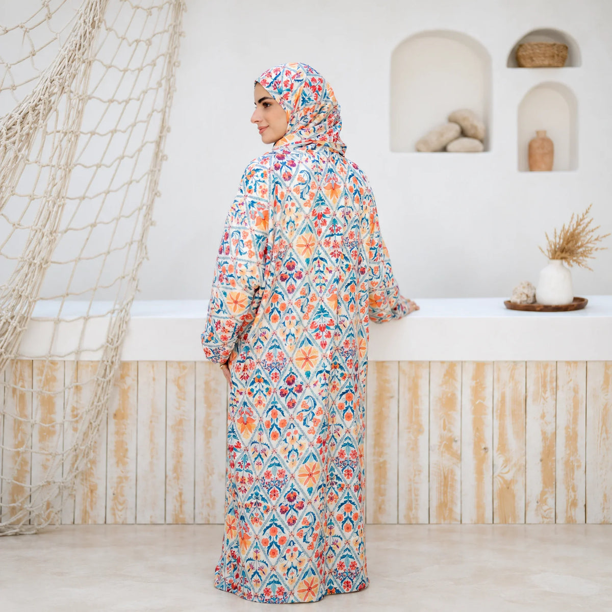 Model wearing Tallah's multicolour floral mosaic-print Soft Mabrad Isdal, gallery photo 1