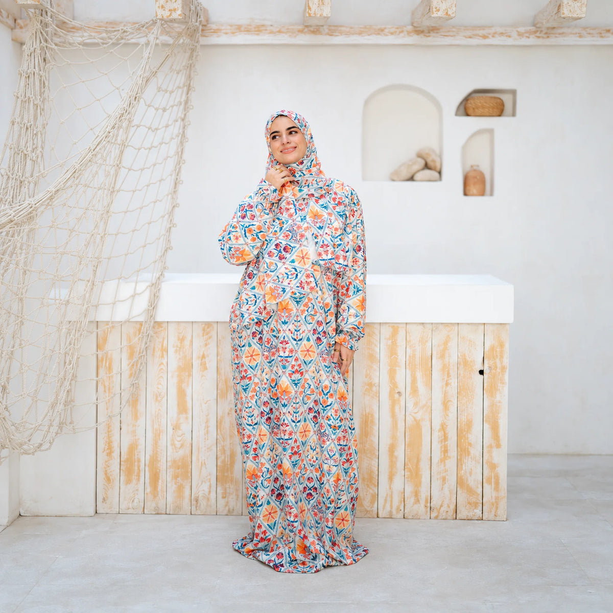 Model wearing Tallah's multicolour floral mosaic-print Soft Mabrad Isdal, gallery photo 5