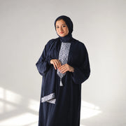 Model wearing Tallah's navy CY Isdal with geometric panel, gallery photo 1