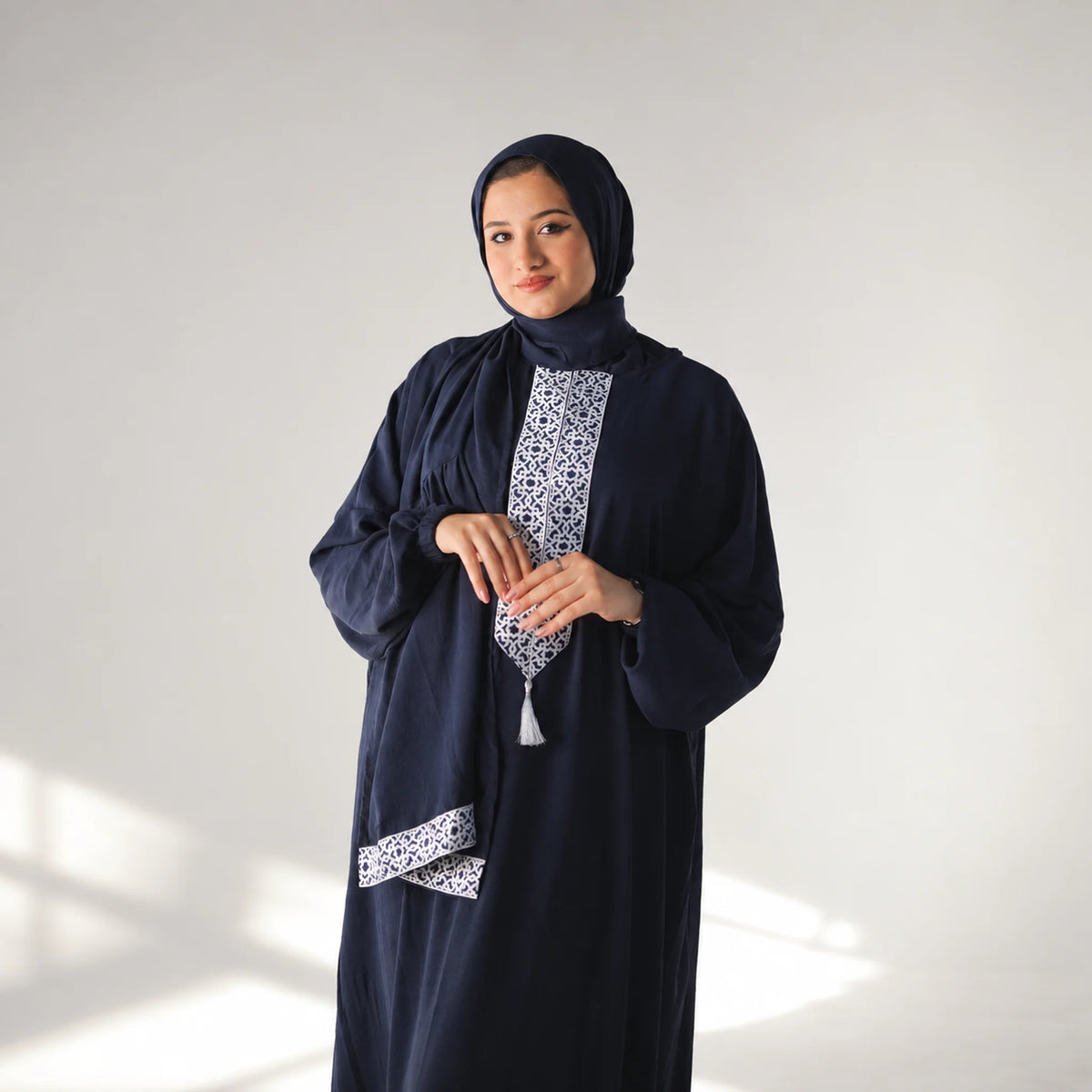 Model wearing Tallah's navy CY Isdal with geometric panel, gallery photo 1