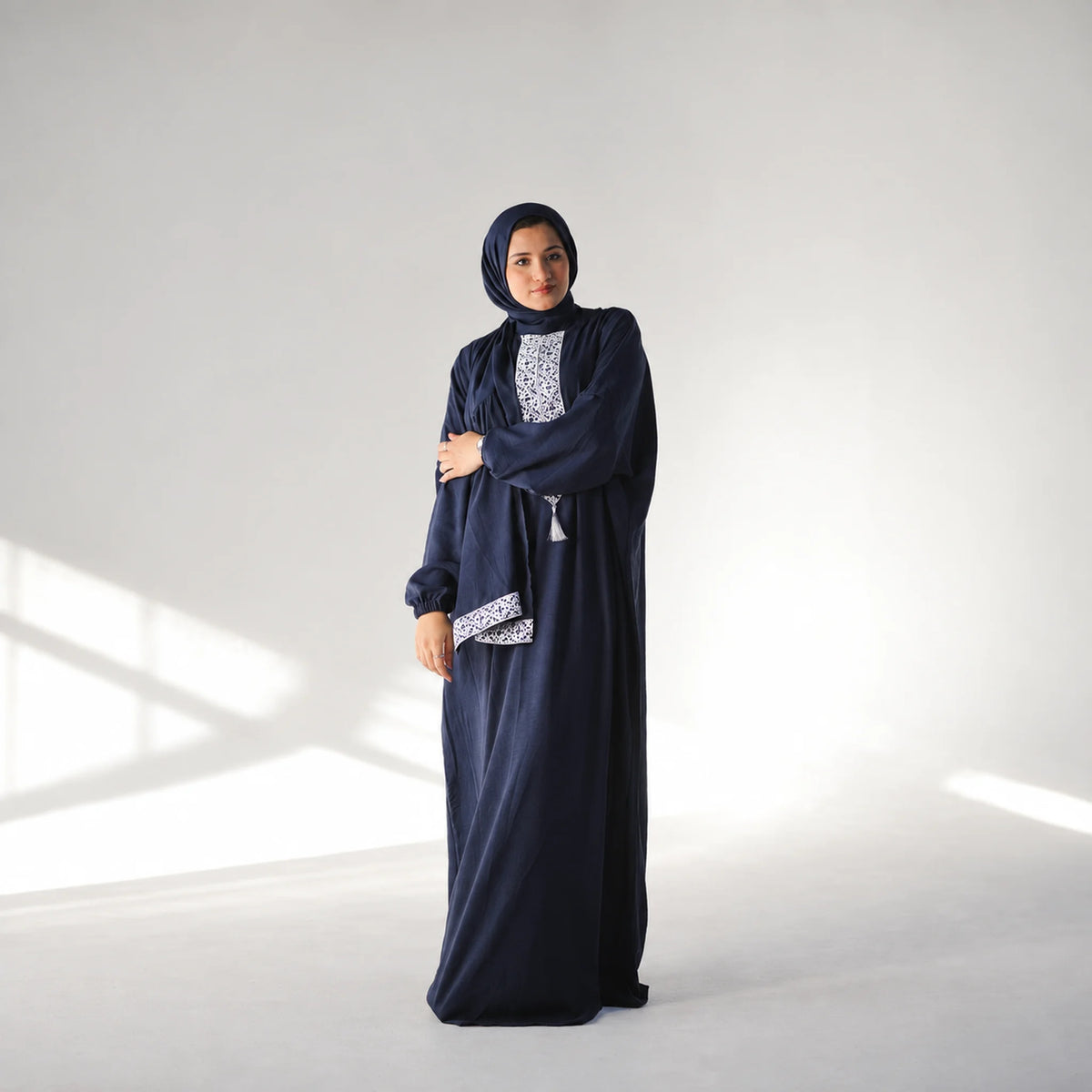 Model wearing Tallah's navy CY Isdal with geometric panel, gallery photo 2