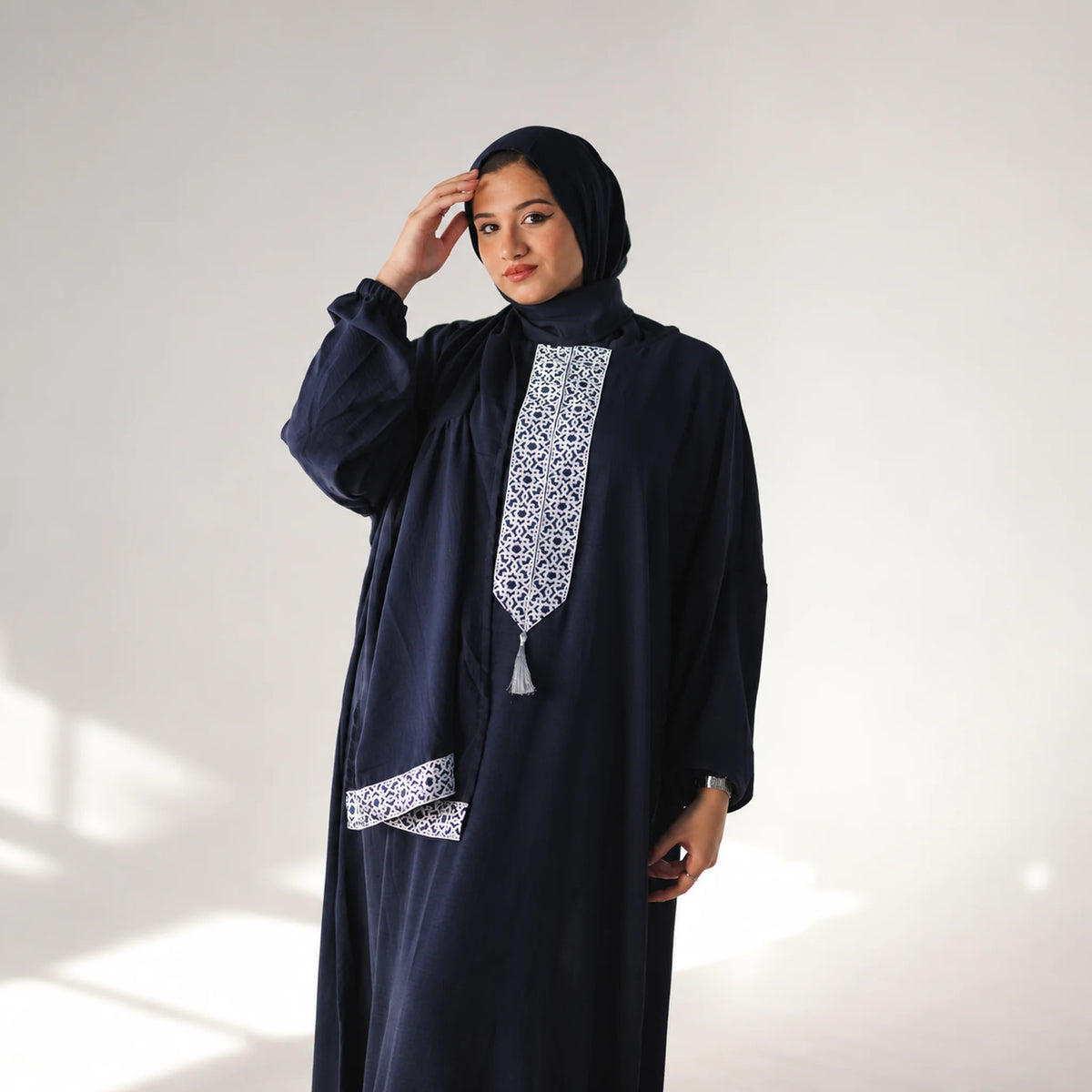 Model wearing Tallah's navy CY Isdal with geometric panel, gallery photo 3