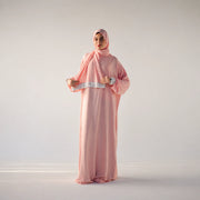 Model wearing Tallah's pink CY Isdal with pearl cuff trim, gallery photo 1
