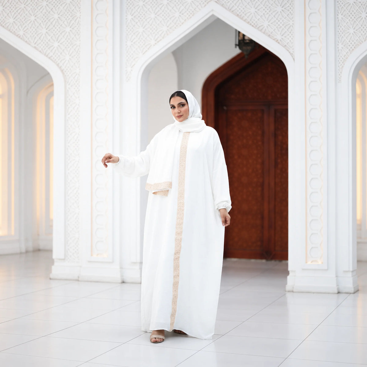 Model wearing Tallah's white CY Isdal with gold beaded trim, gallery photo 2