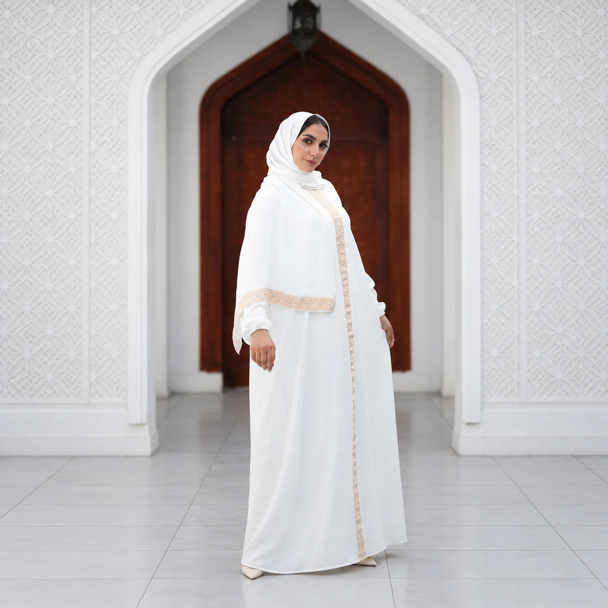 Model wearing Tallah's white CY Isdal with gold beaded trim, gallery photo 3
