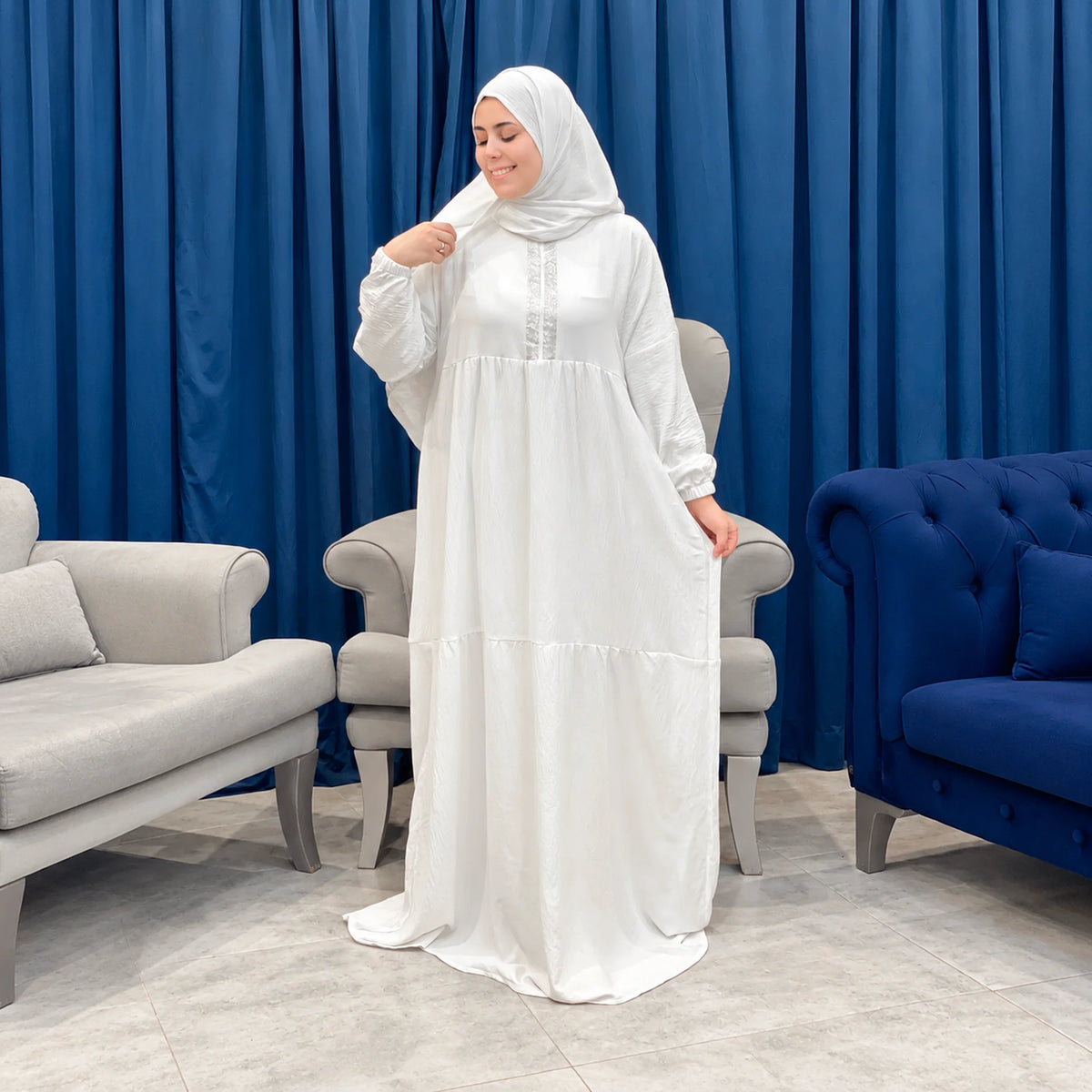 Model wearing Tallah's white CY Isdal with a tiered silhouette, gallery photo 3
