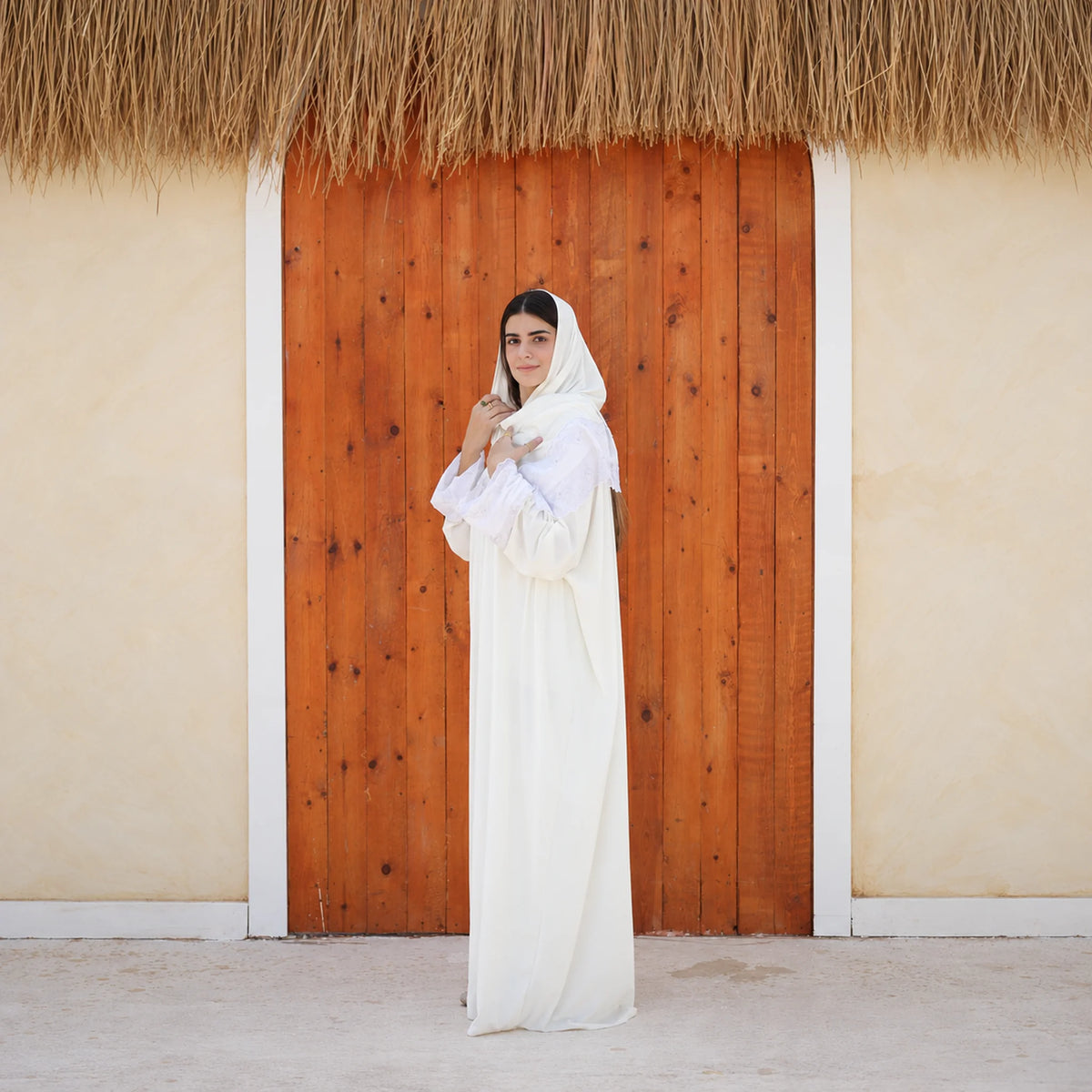 Model wearing Tallah's white Velvet Isdal with lace trim, gallery photo 2