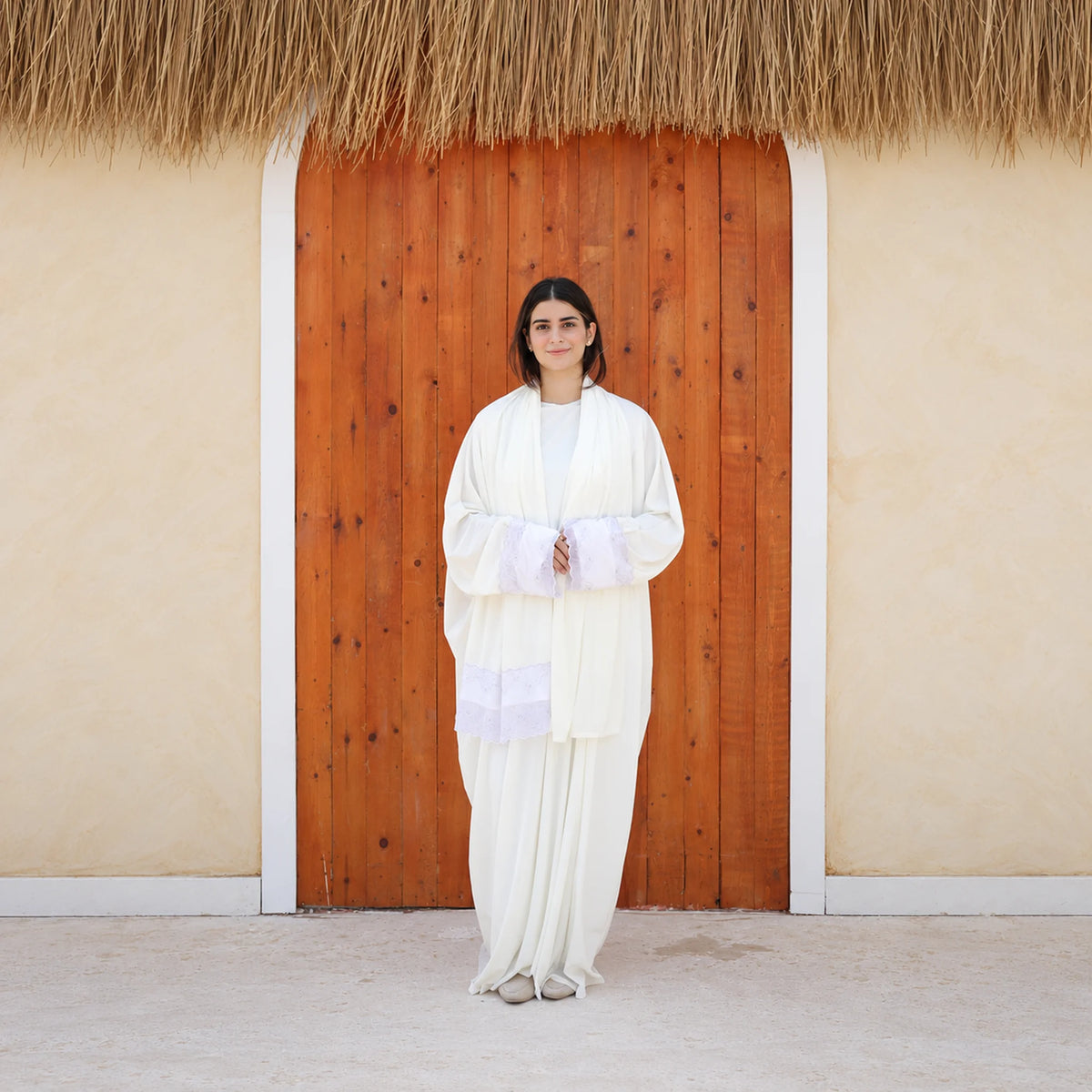 Model wearing Tallah's white Velvet Isdal with lace trim, gallery photo 5