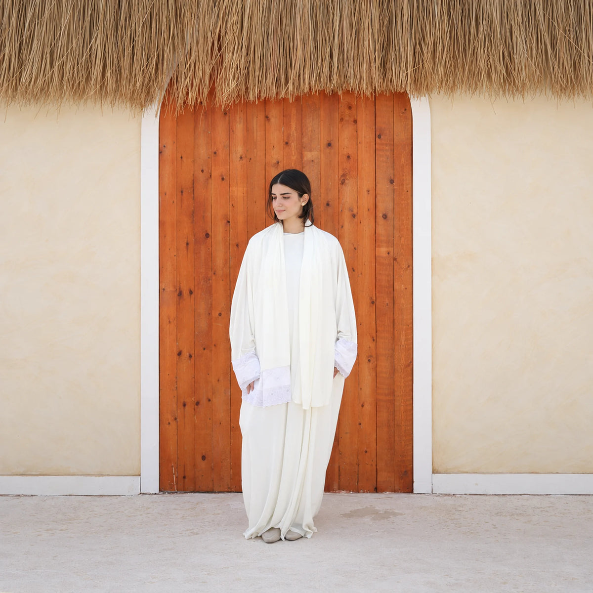 Model wearing Tallah's white Velvet Isdal with lace trim, gallery photo 6
