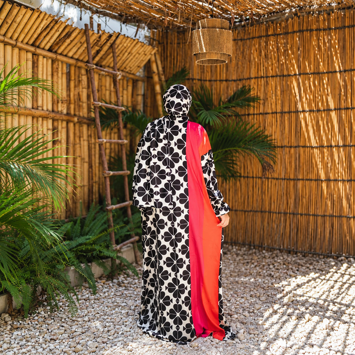 Isdal in Soft Mabrad in Black & cream, floral print with red panel with matching veil, gallery view 1.
