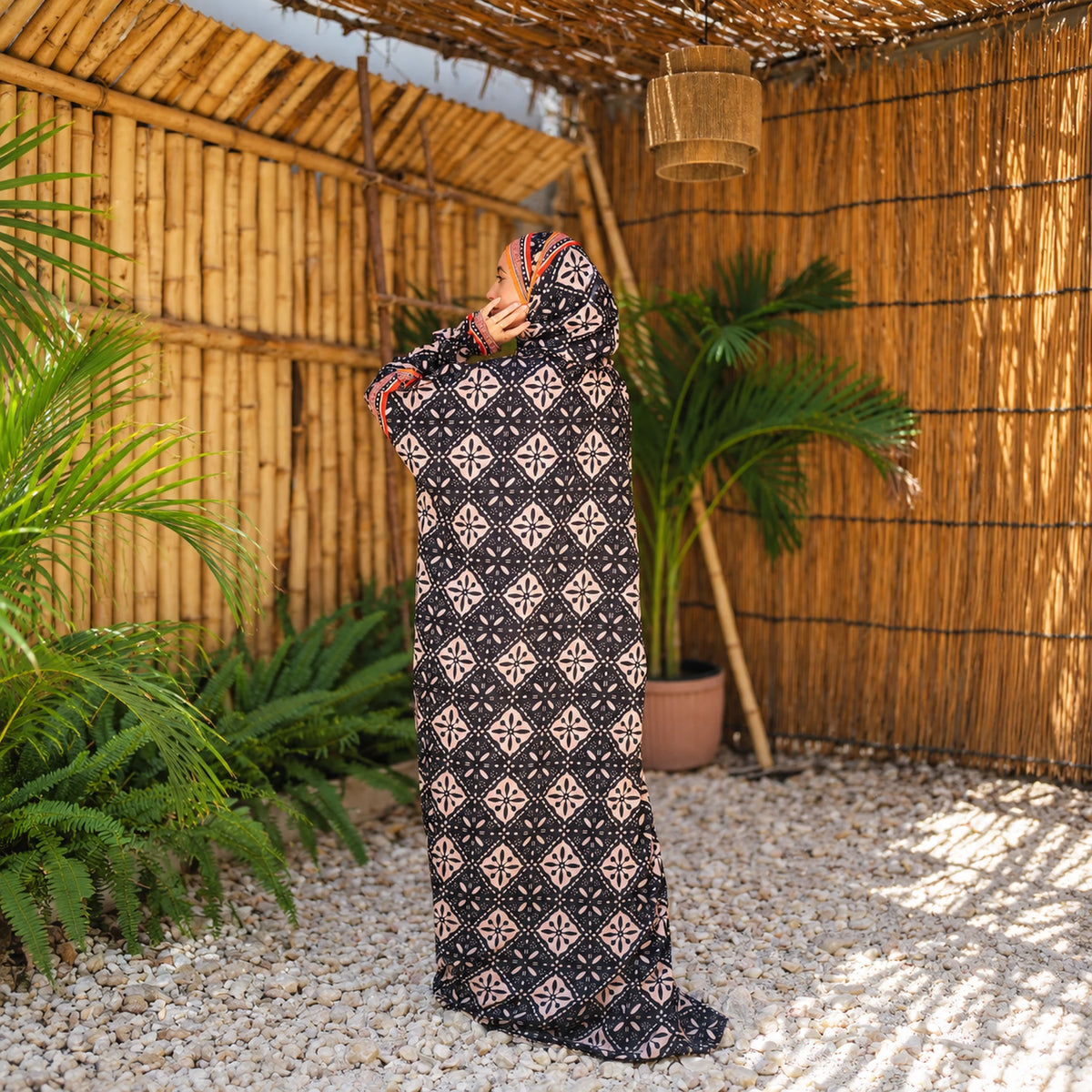 Isdal in Soft Mabrad in Black & cream, geometric print with orange trim with matching veil, gallery view 2.