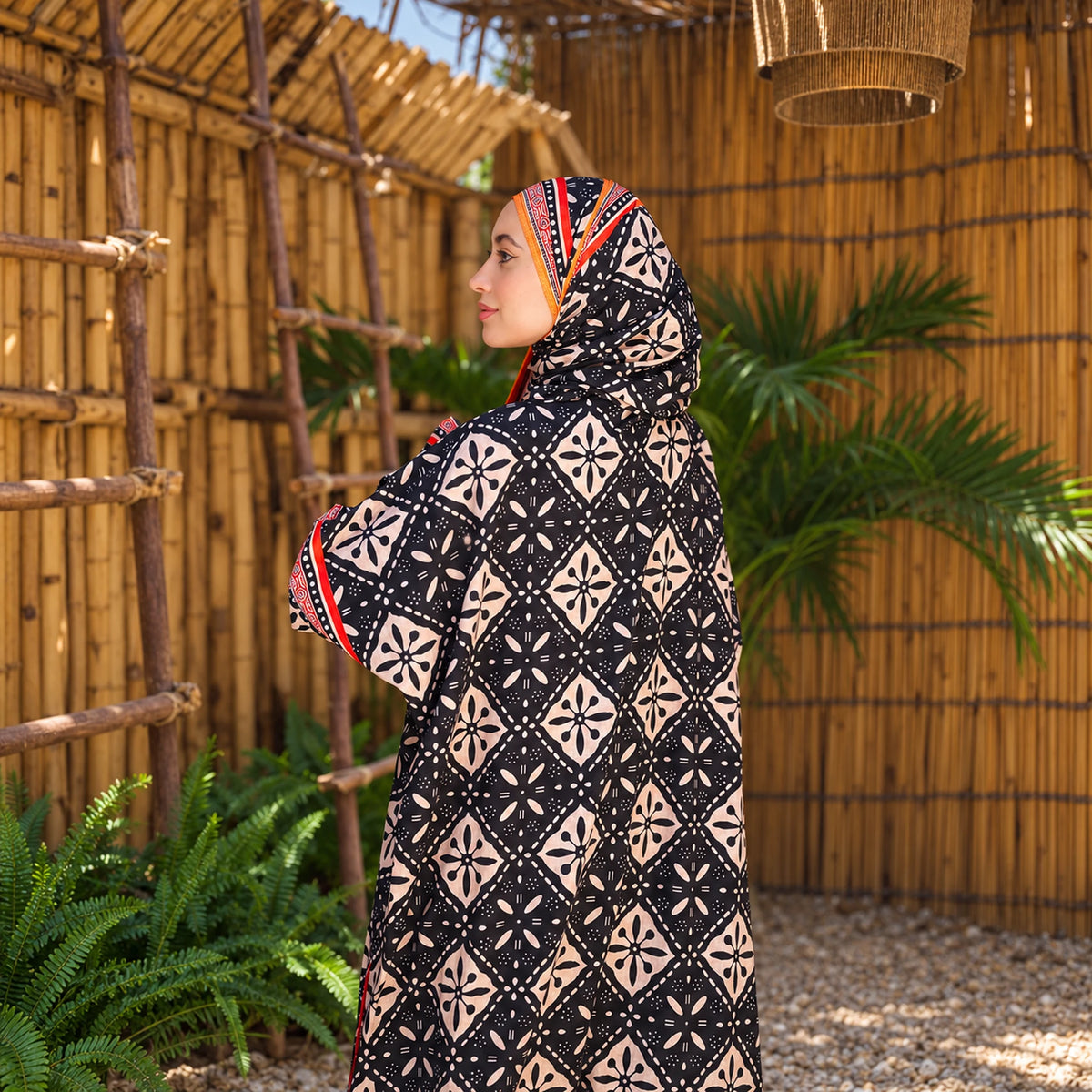 Isdal in Soft Mabrad in Black & cream, geometric print with orange trim with matching veil, gallery view 3.