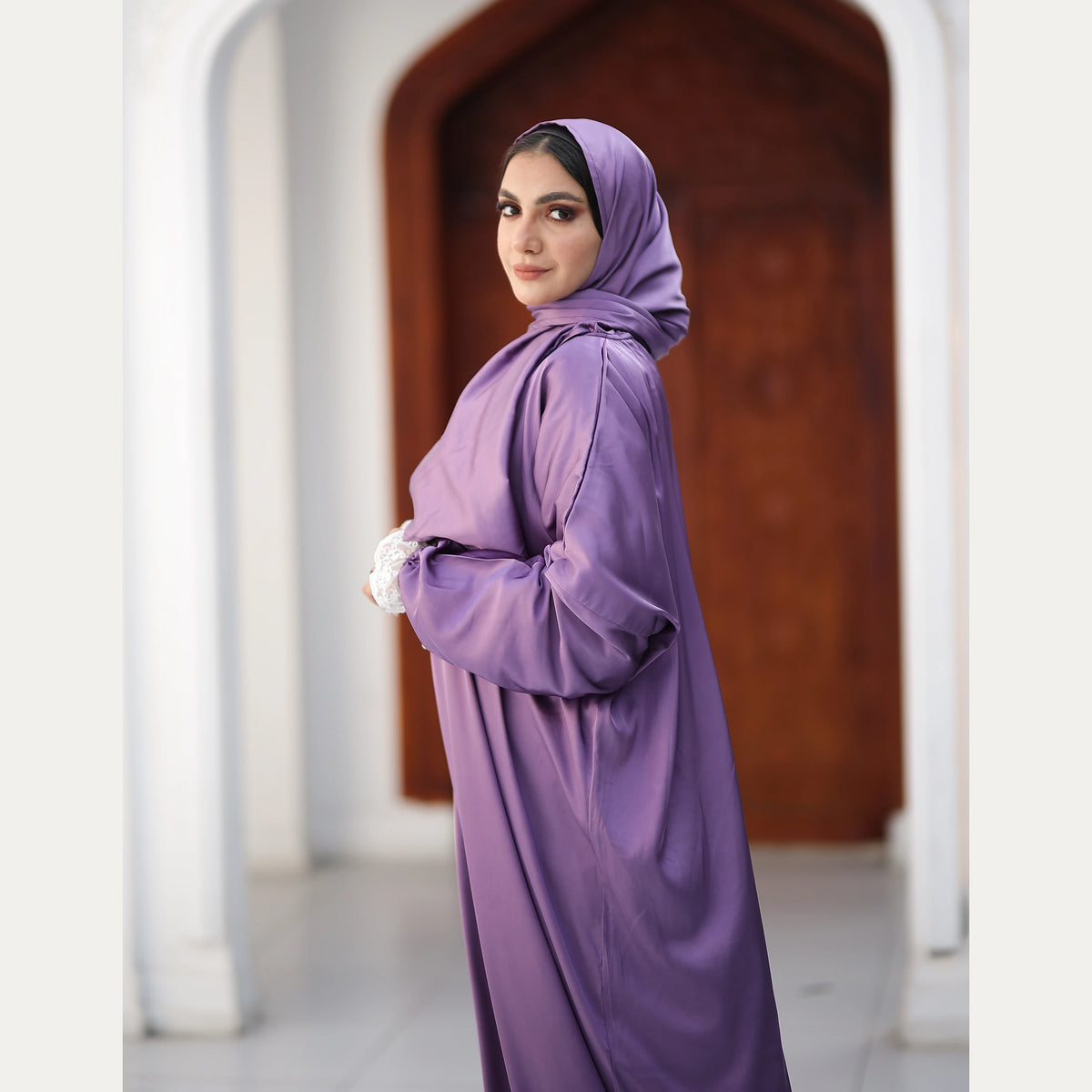 Tallah satin Isdal in Lilac, lace detail, three-quarter view showing sleeve and drape.