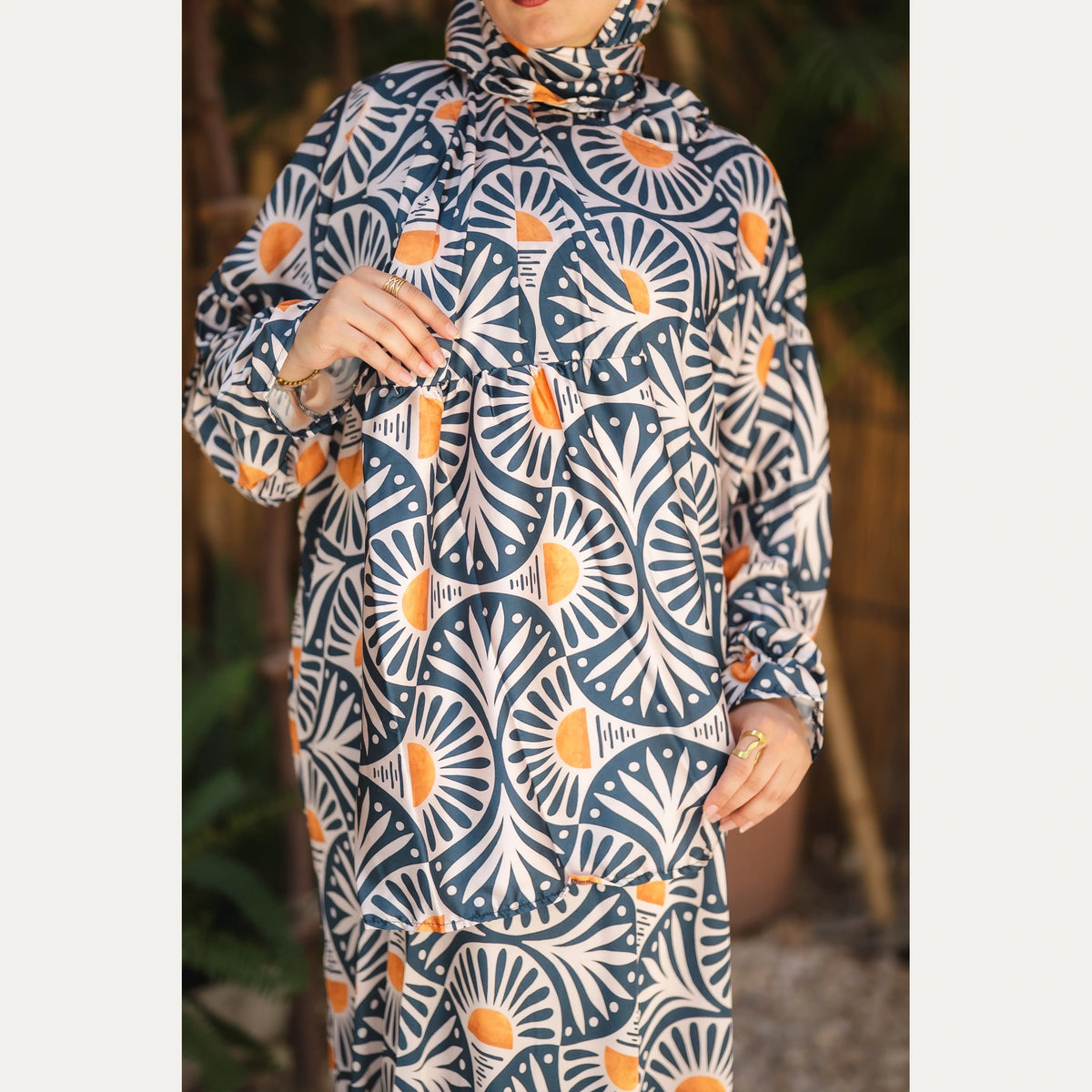 Tallah satin Isdal in Navy, Cream and Orange, fan pattern, close-up of fan print, sleeve and front buttons.