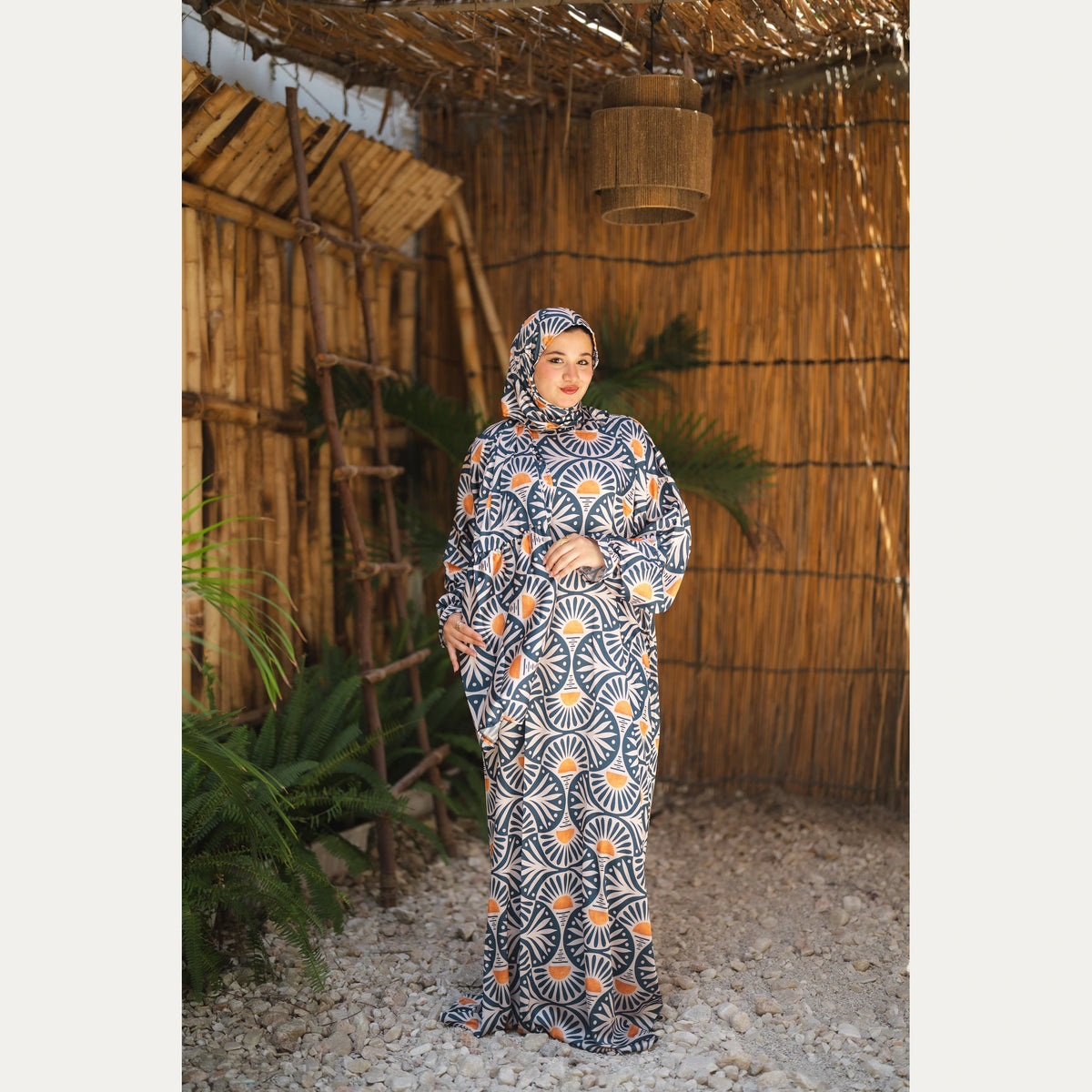 Tallah satin Isdal in Navy, Cream and Orange, fan pattern, full-length front view with hands together.
