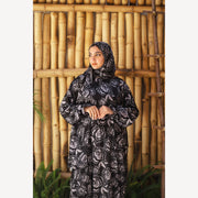 Tallah satin Isdal in black grey rose, closer front view showing head covering and sleeves.