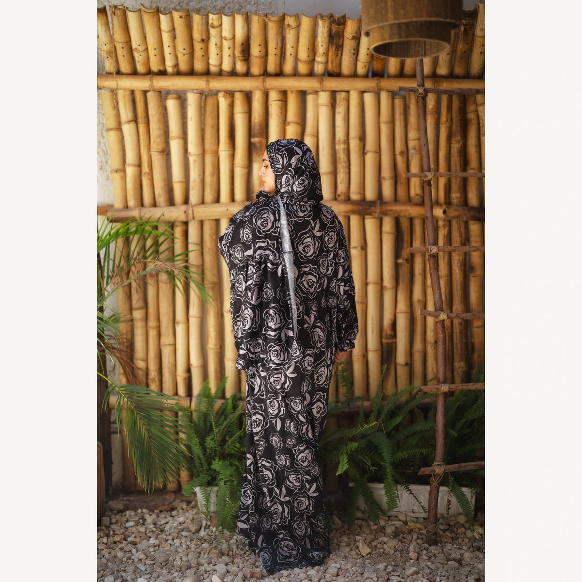 Tallah satin Isdal in black grey rose, full-length back view.