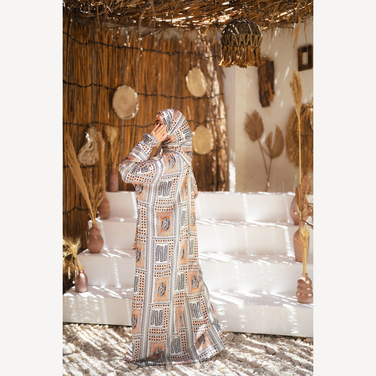 Tallah satin Isdal in cream black orange geometric, full-length back three-quarter view.