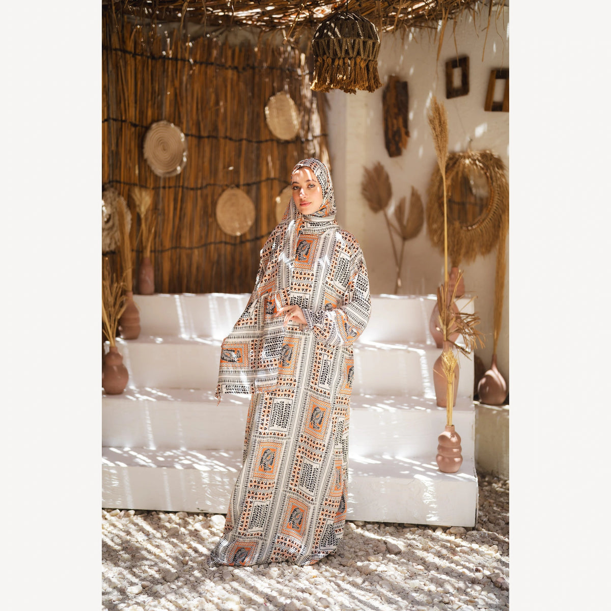 Tallah satin Isdal in cream black orange geometric, full-length front view with arms lowered.